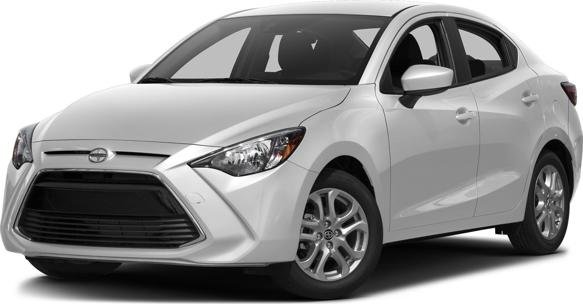 Sharp headlights and large front grille of a subcompact sedan