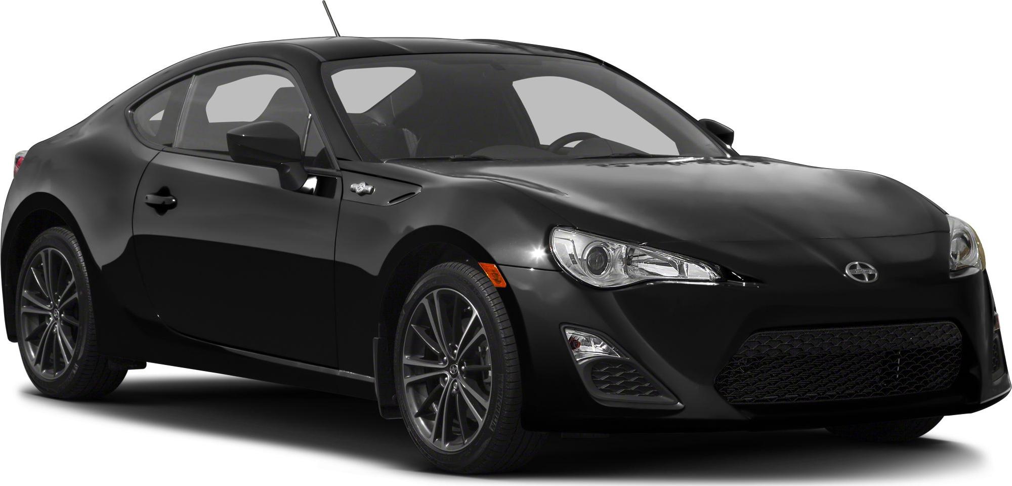 Front side view of black sports coupe with sleek headlights and alloy wheels
