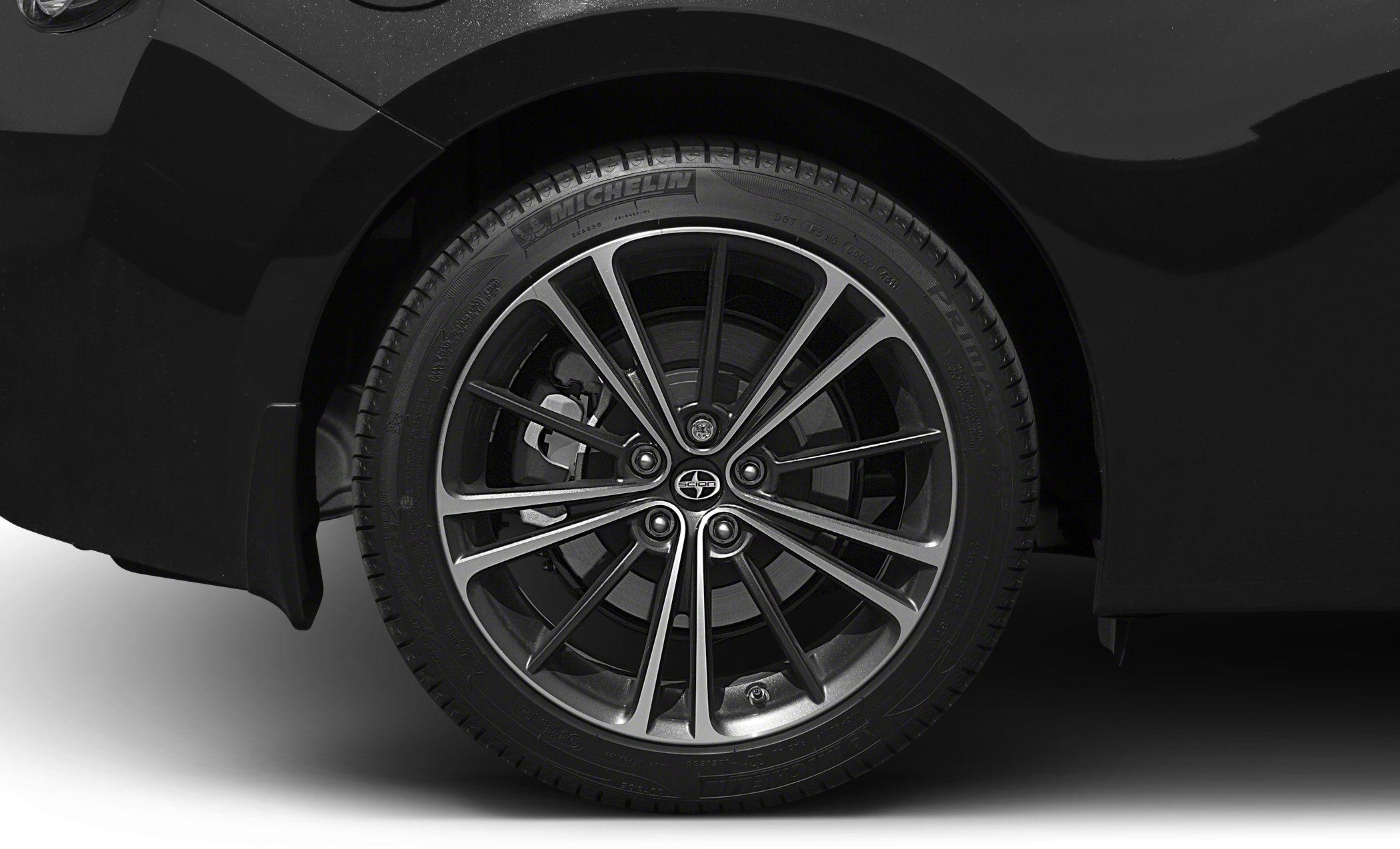 Detailed alloy wheel with Michelin tire and visible brake caliper