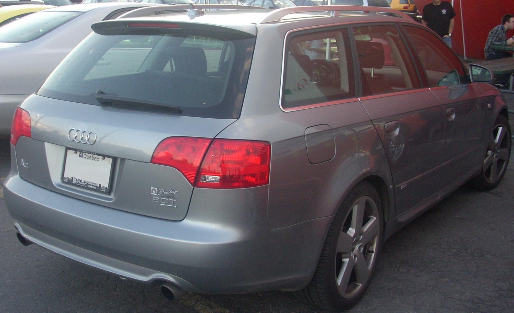 Rear view of a silver wagon with tail lights and alloy wheels