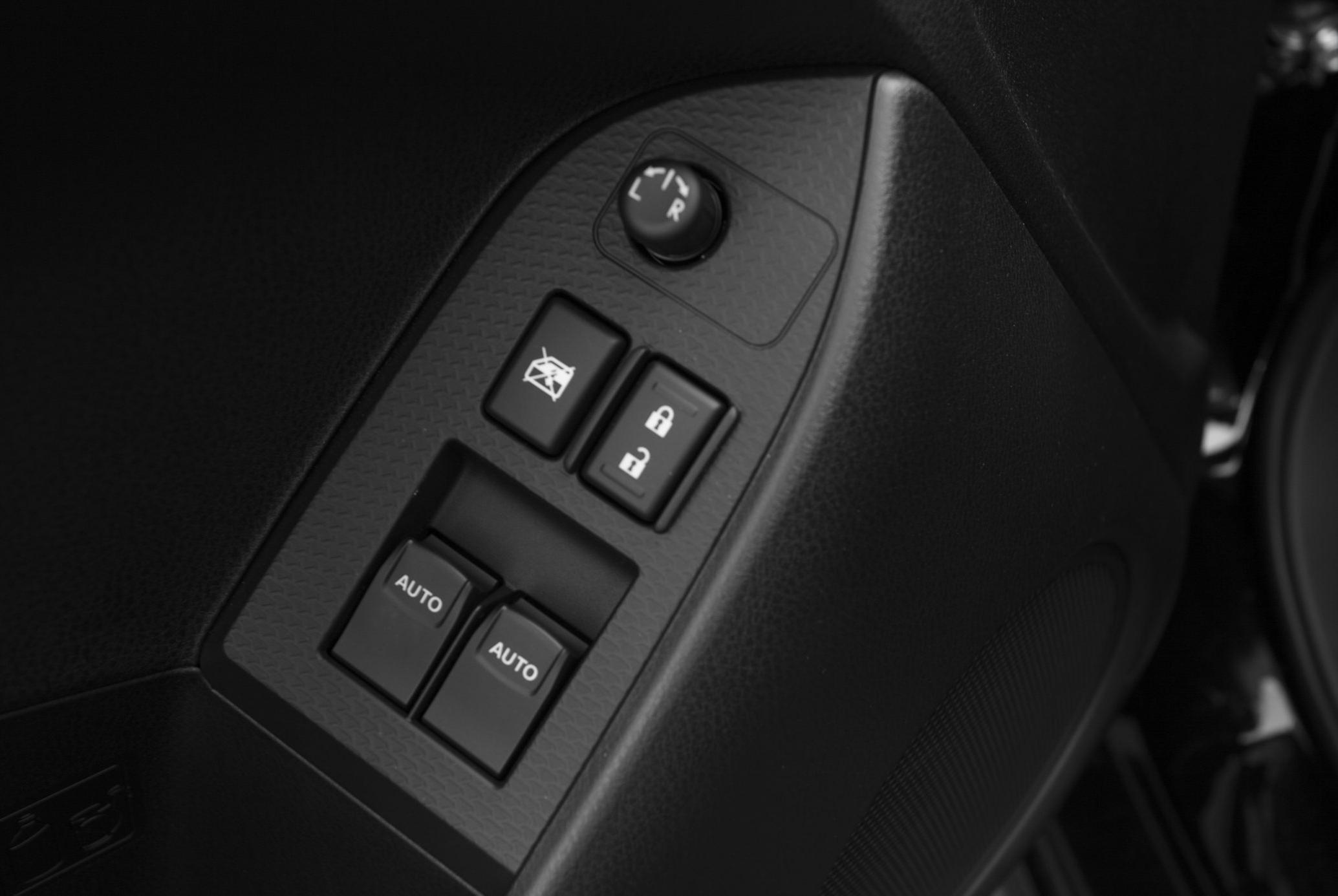 Power window switches, door lock buttons, side mirror adjustment knob