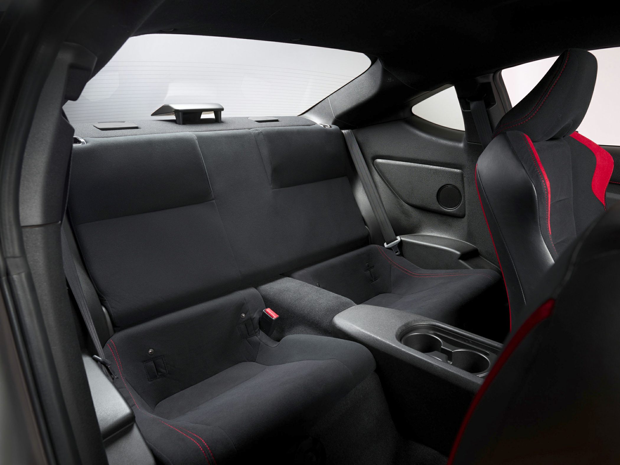 Sporty rear bucket-style seats with red-stitched front seat accents