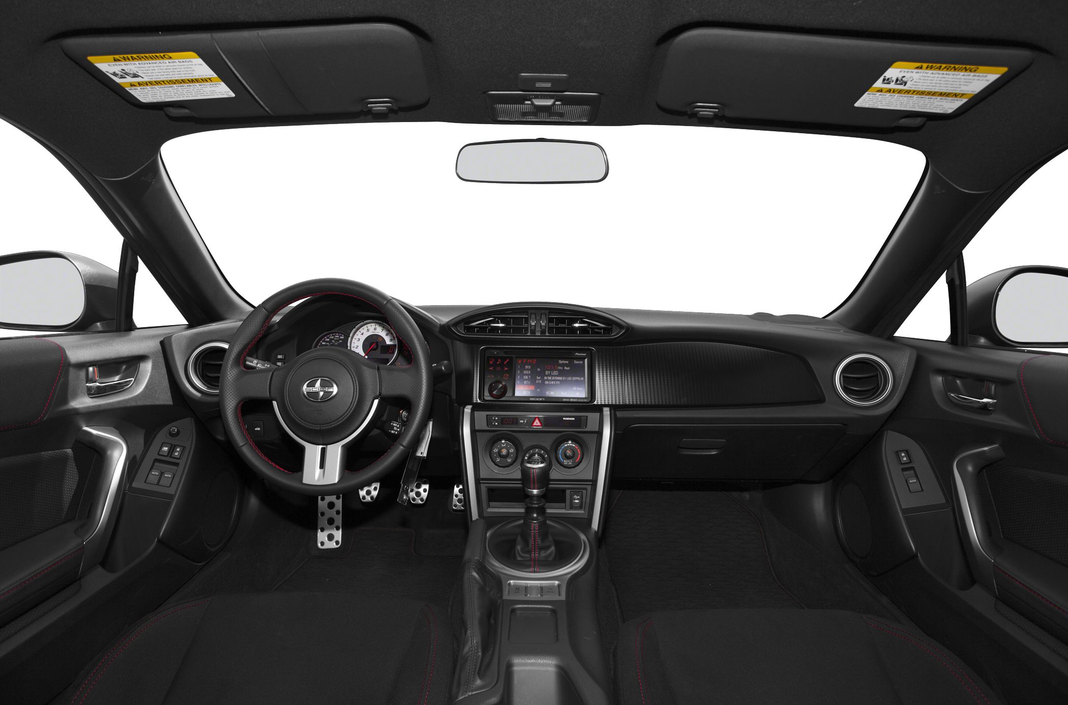 Car interior dashboard, steering wheel, and manual gear shift