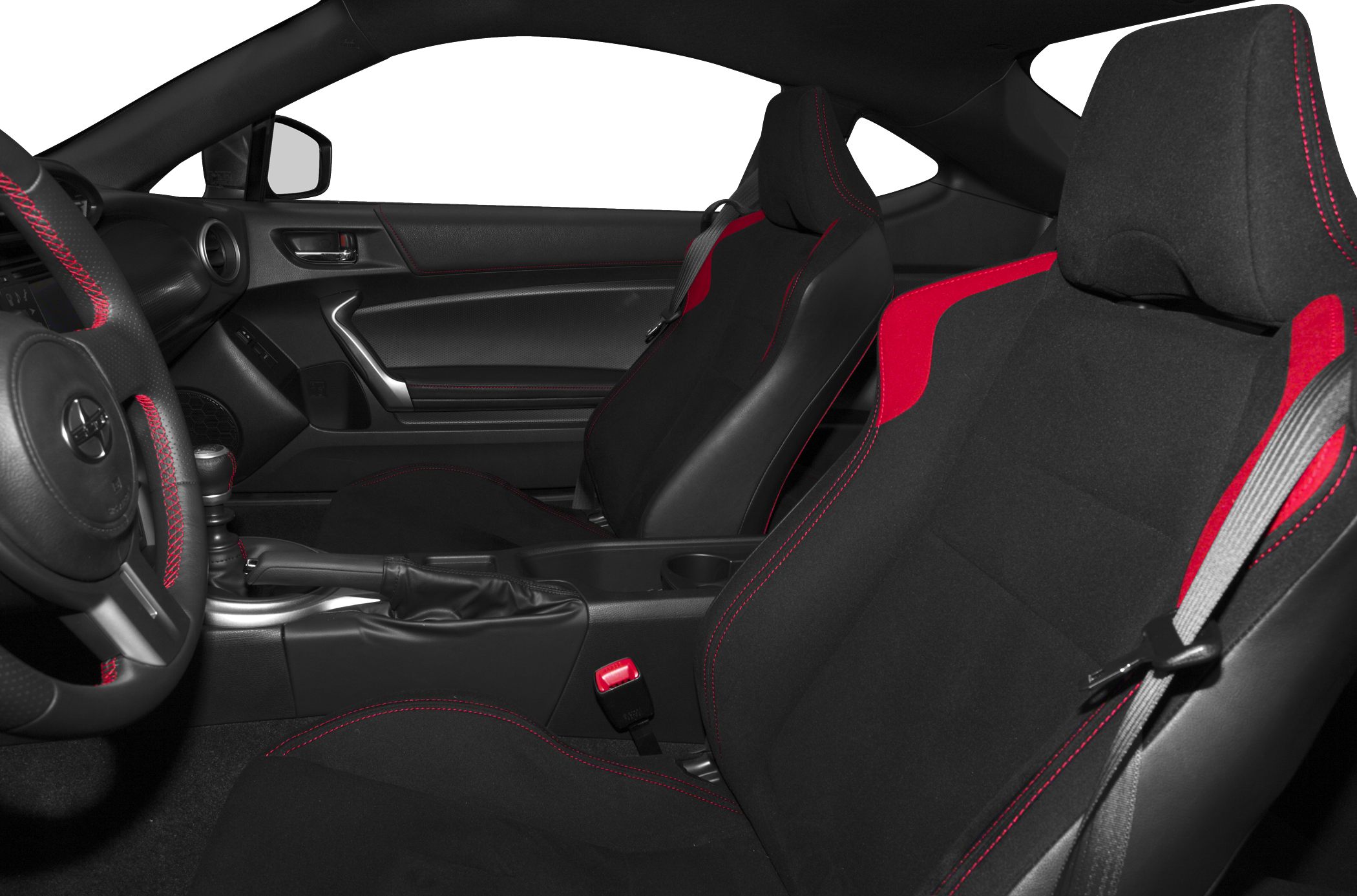 Sporty black seats with red stitching and manual gear shifter in car interior