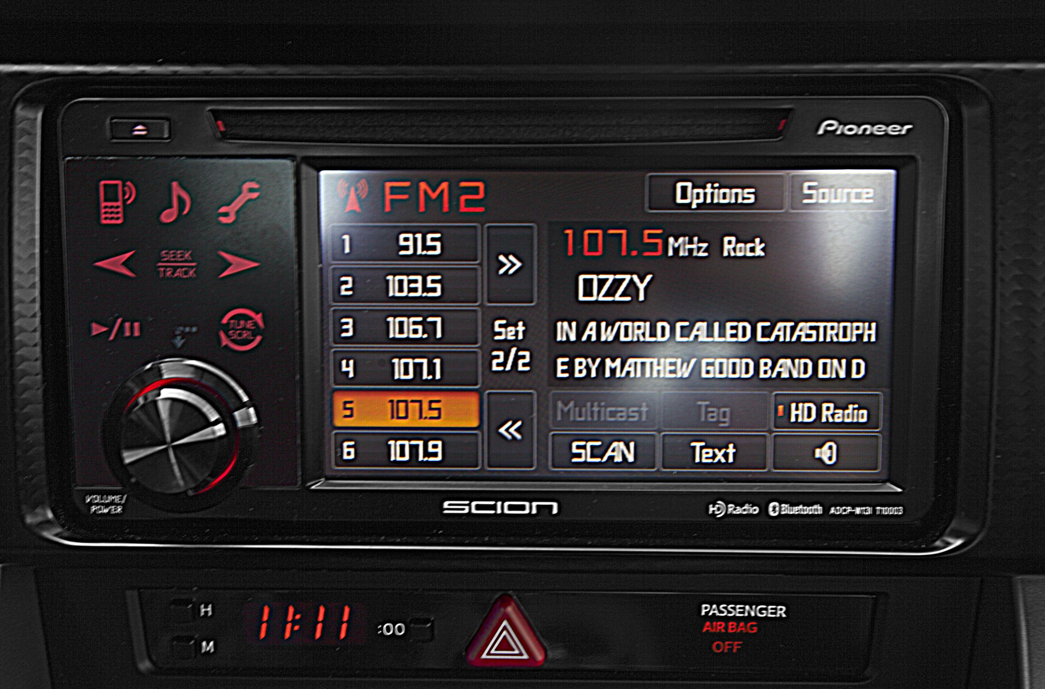 Digital FM radio display with frequency presets and song info