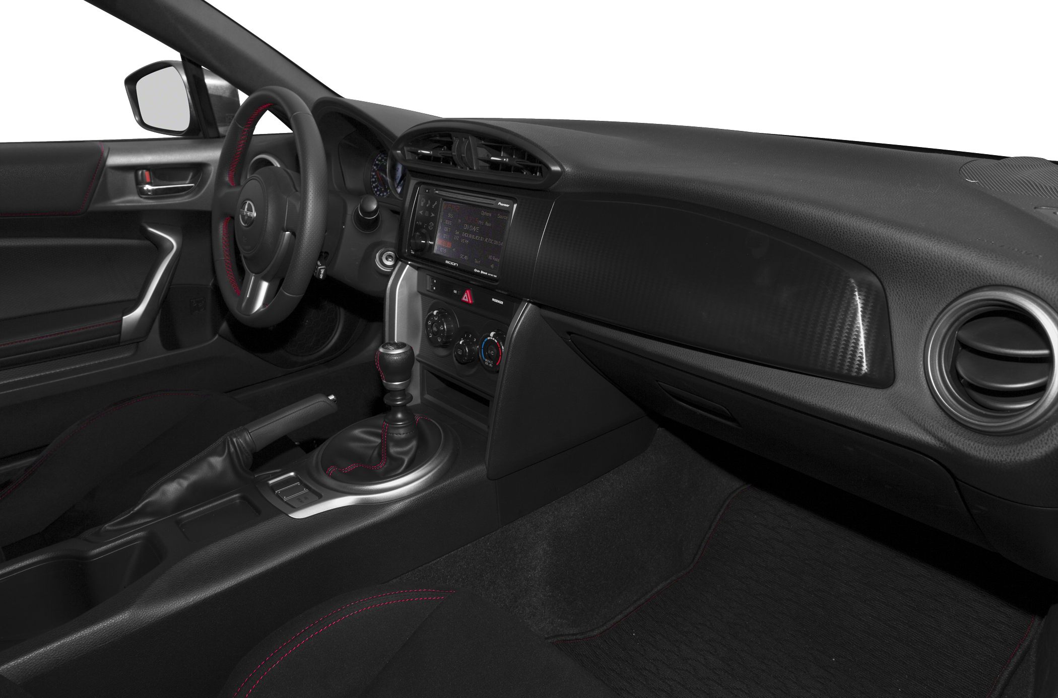 Manual transmission gear shifter and infotainment screen with red stitching accents