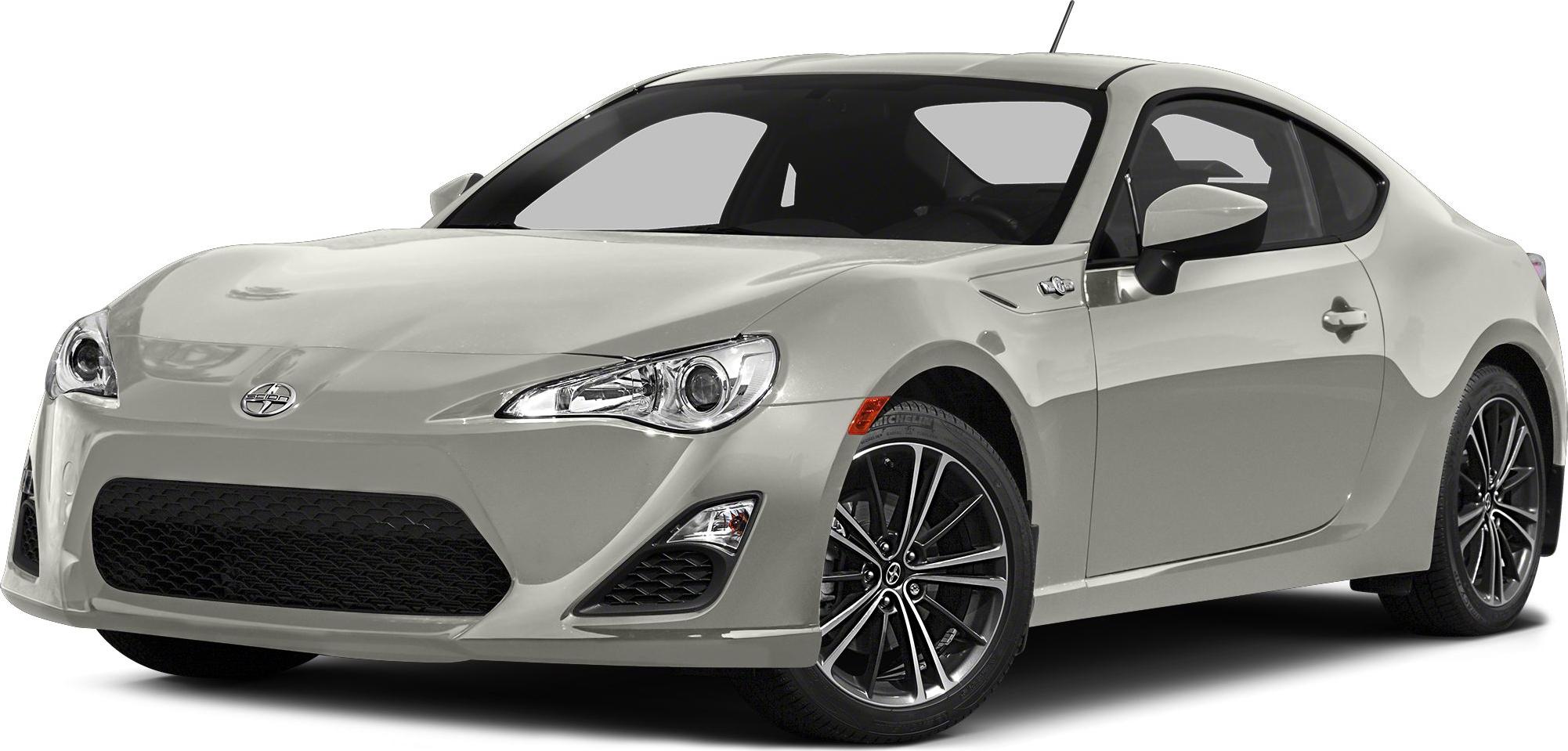 Front side view of sporty coupe with alloy wheels in light gray.