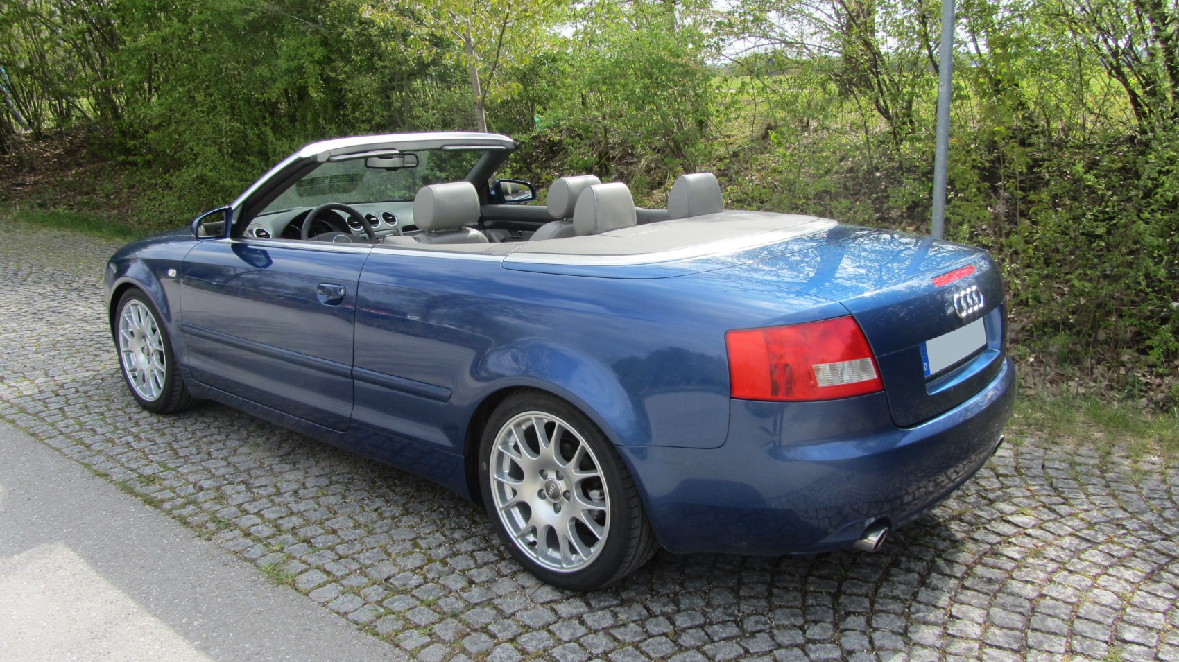 Convertible rear view with silver alloy wheels and open roof