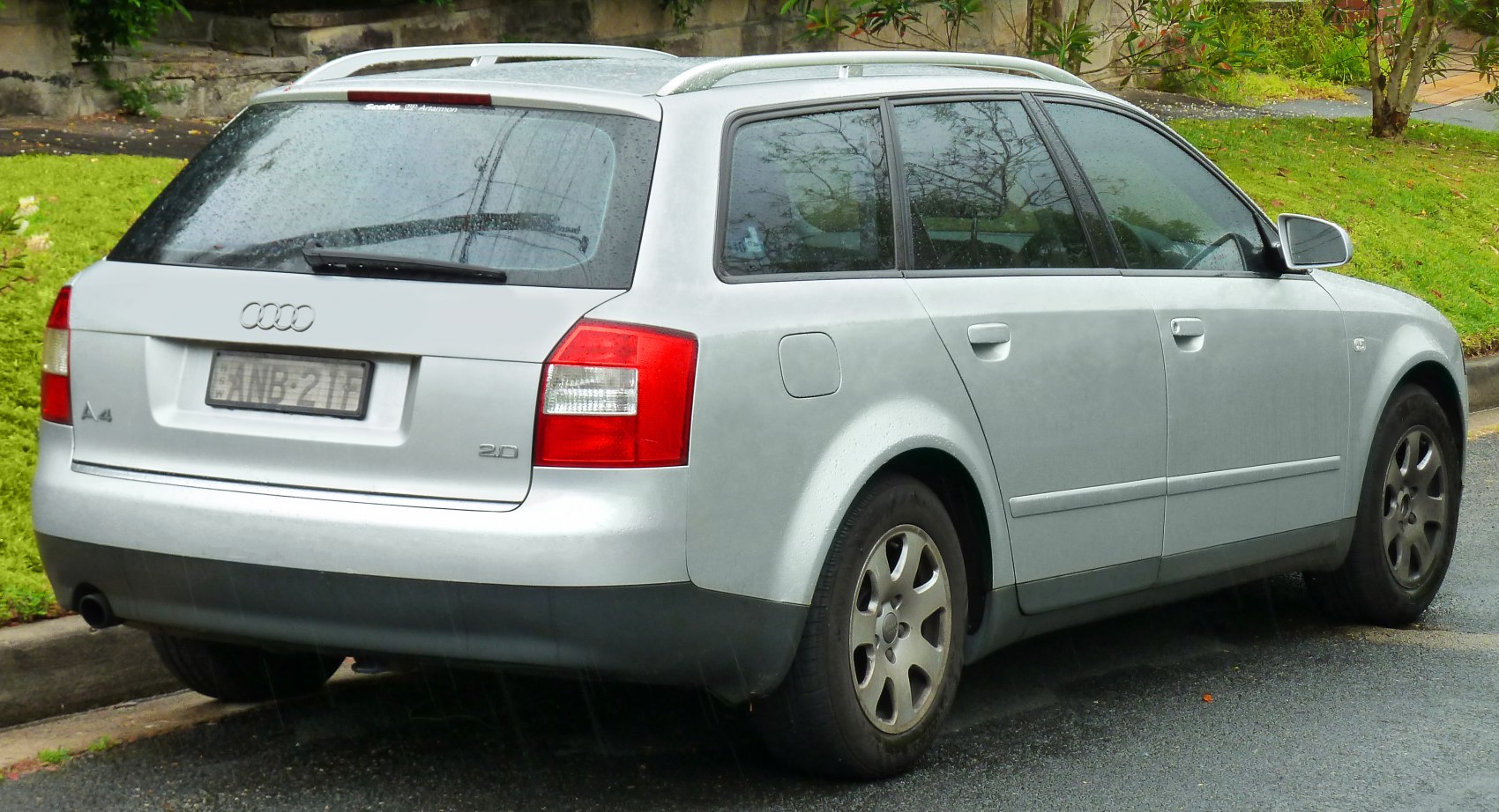 Silver station wagon rear and side view showing body and wheel details