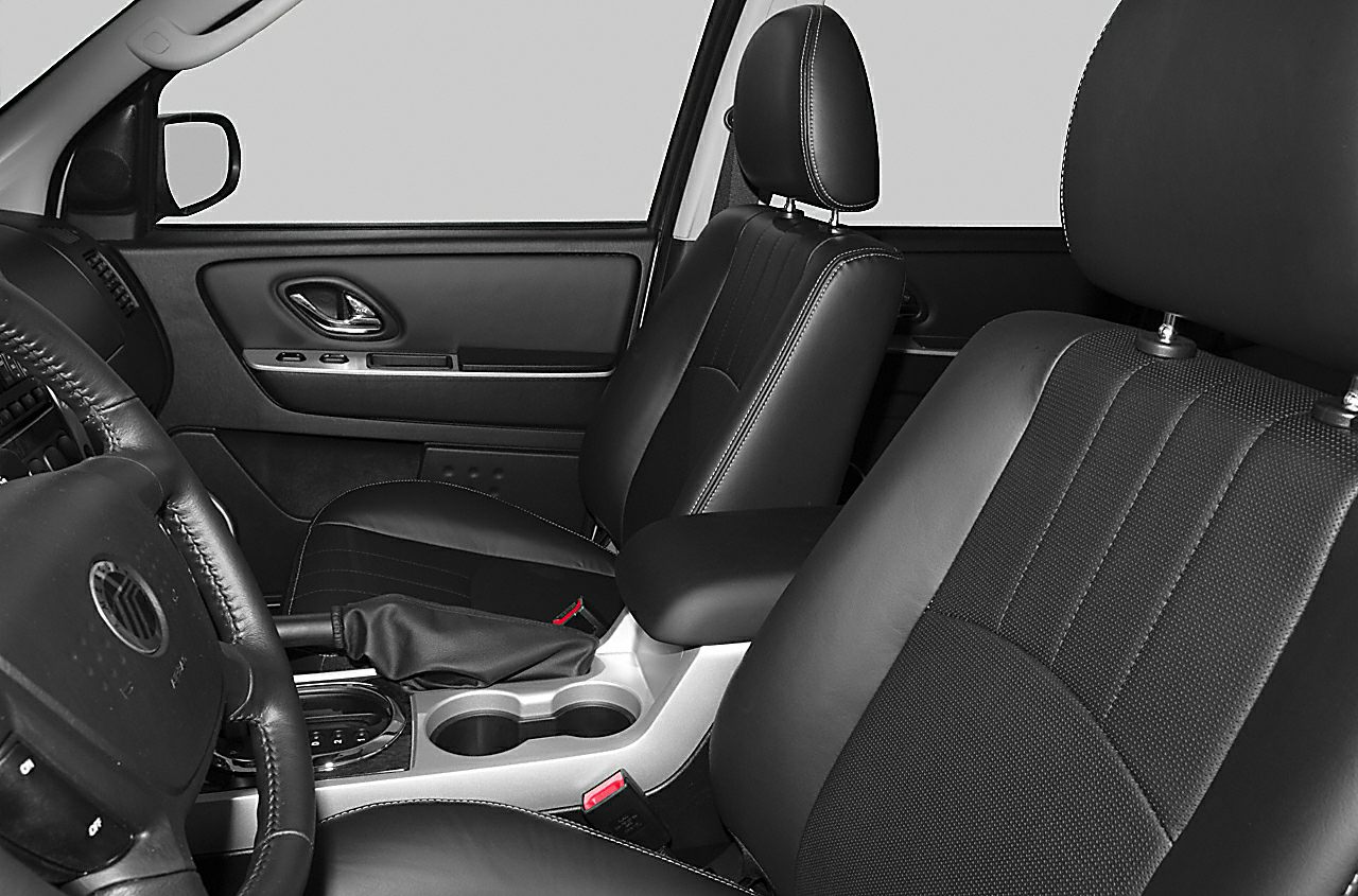 Black leather seats with center console and door panel in SUV interior