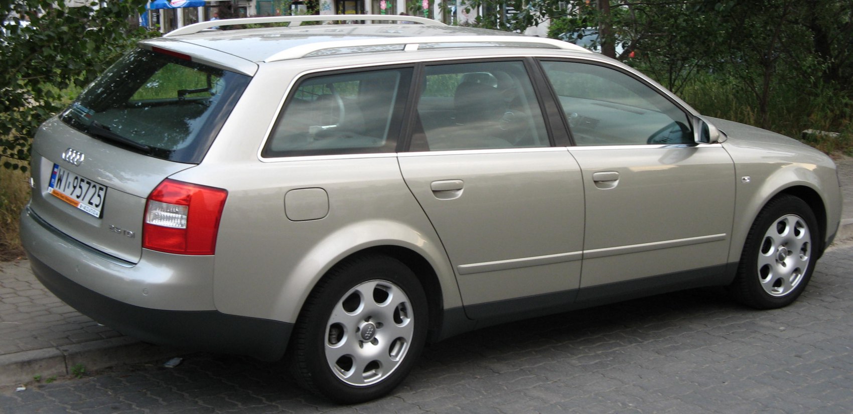 Silver station wagon side and rear exterior with alloy wheels