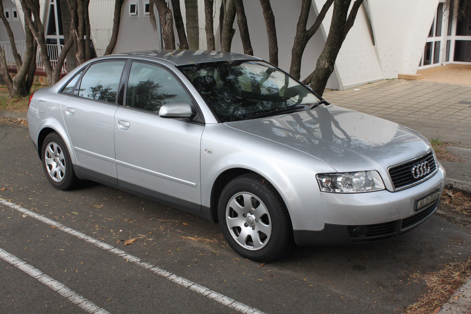 Silver sedan with alloy wheels and quad headlights
