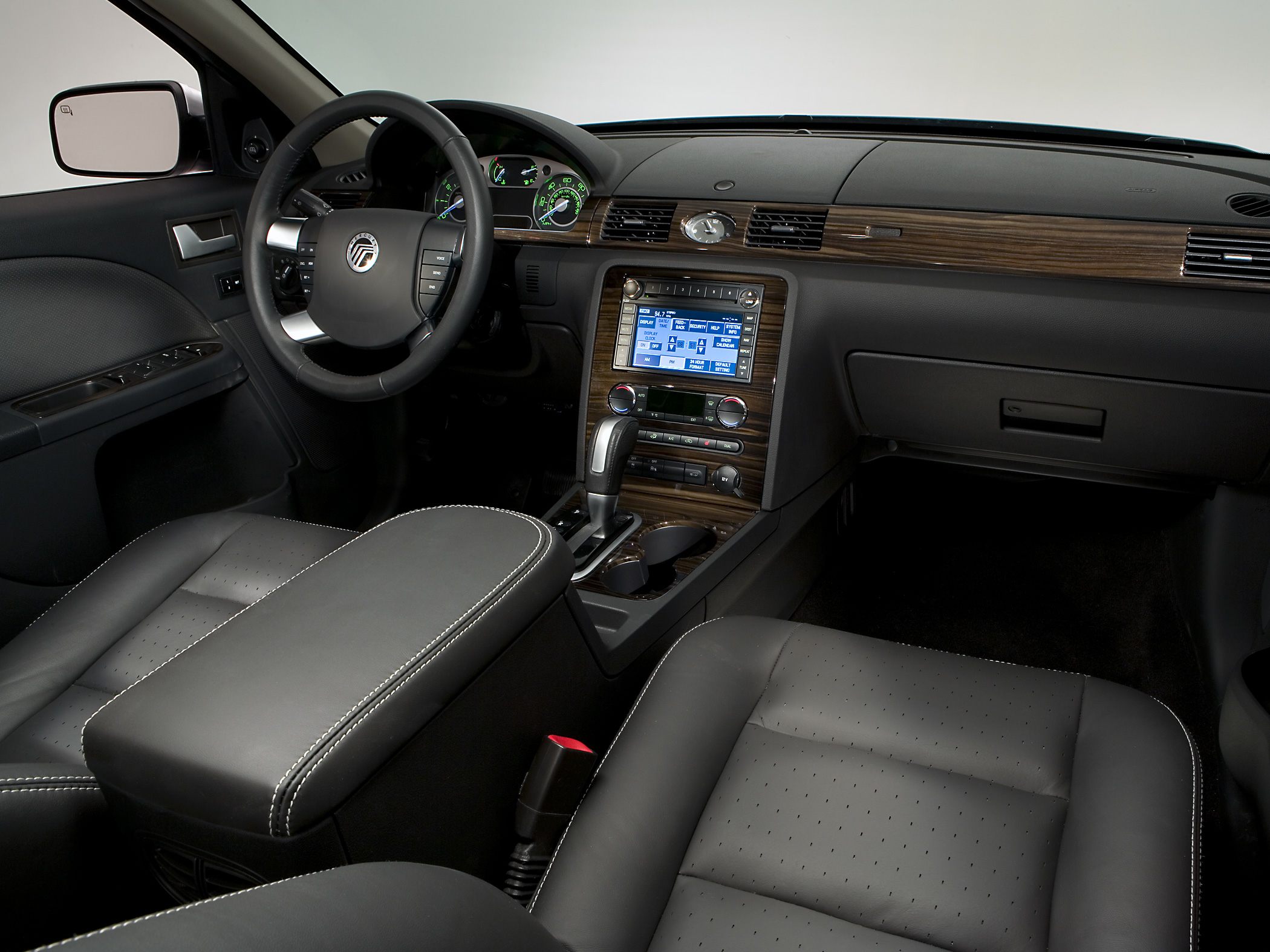 Leather seats, wood-trimmed dashboard, infotainment screen, steering wheel controls