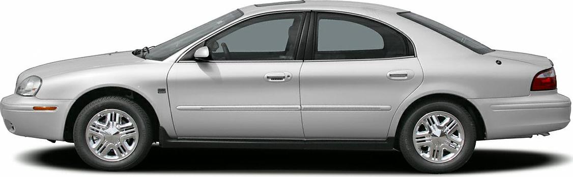 Side profile of a classic mid-2000s sedan with chrome wheels