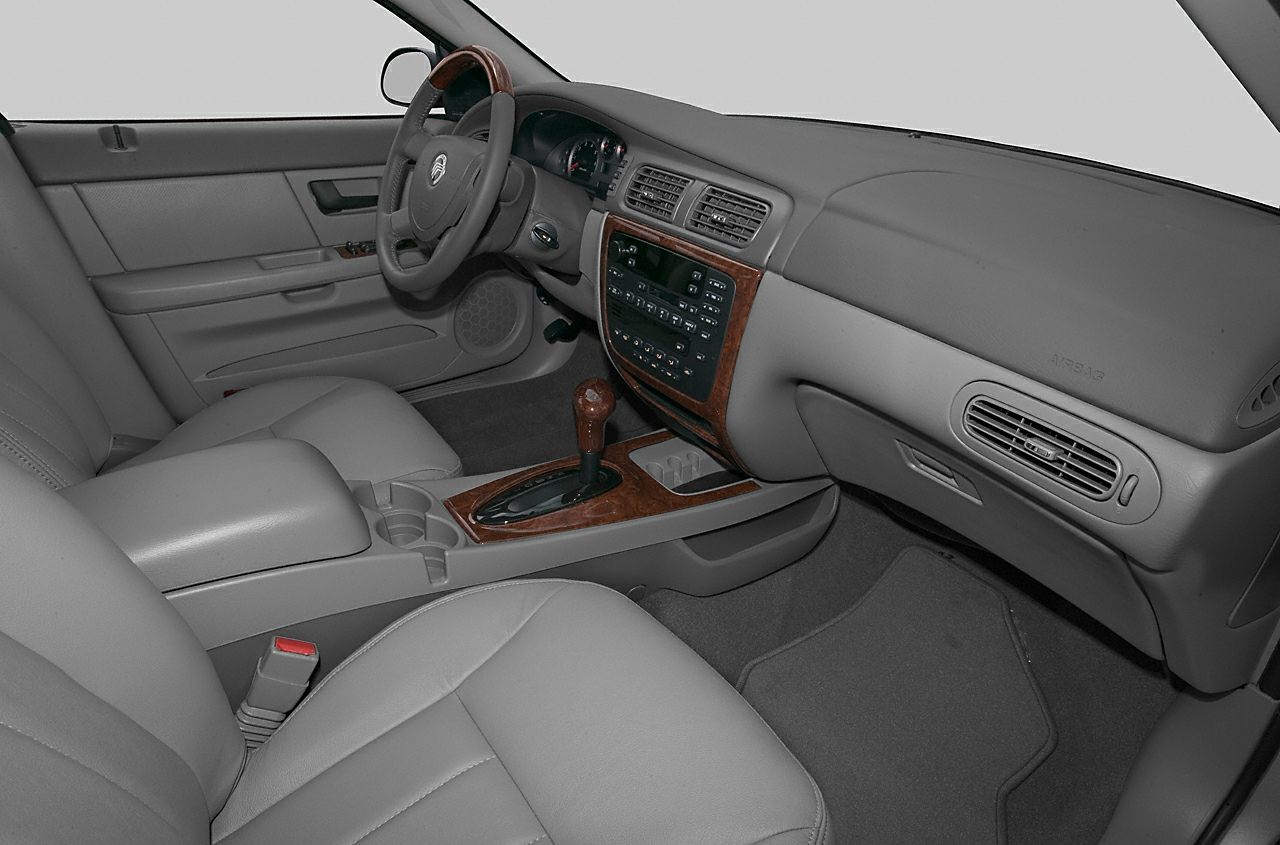 Grey leather seats with wood trim dashboard and center console