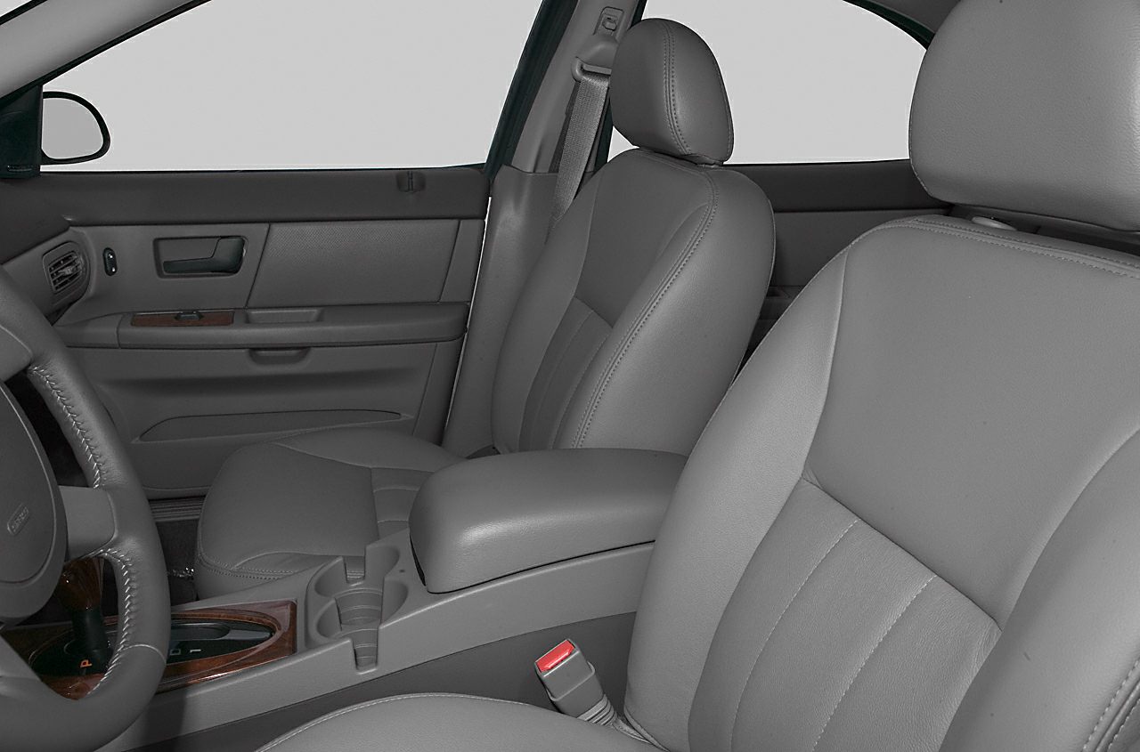 Grey leather front seats with center armrest and door panel
