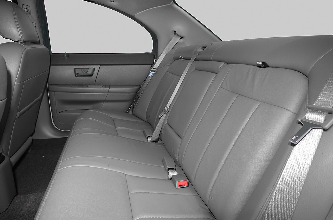 Rear leather seats with seatbelts and door panel interior.