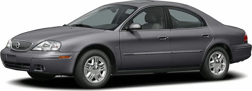 Side view of a gray four-door sedan with chrome alloy wheels.