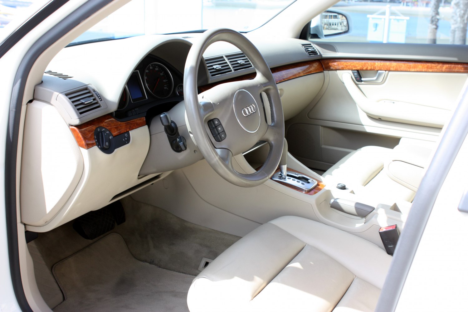 Steering wheel, dashboard, and wood panel trim in car interior