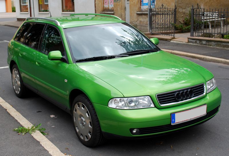 Green station wagon with roof rails and original wheel covers