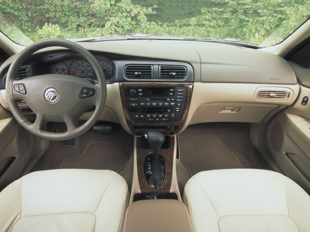 Beige dashboard and steering wheel with automatic gear shift