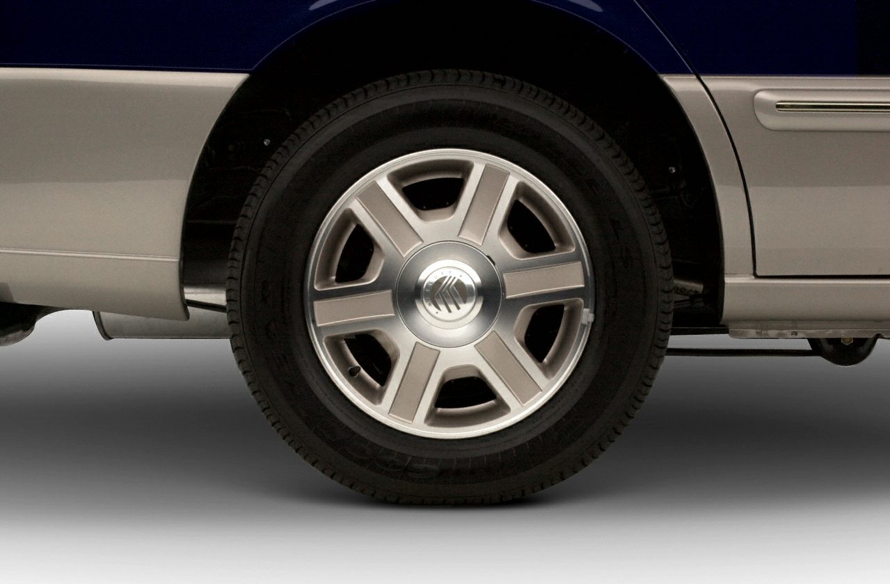 Close-up of alloy wheel and tire profile on a vehicle.