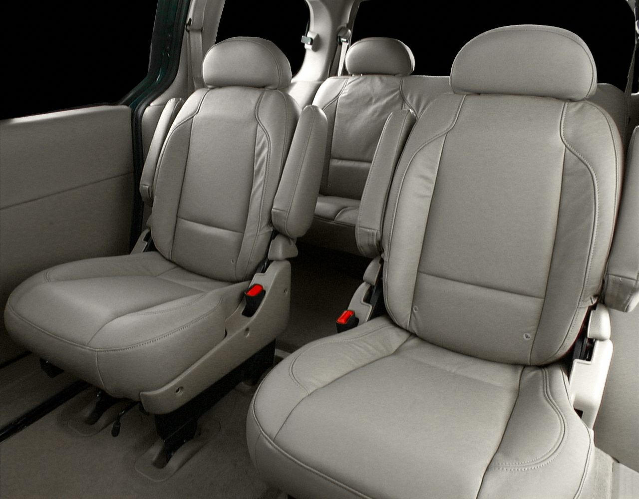 Taupe leather captain seats in minivan interior