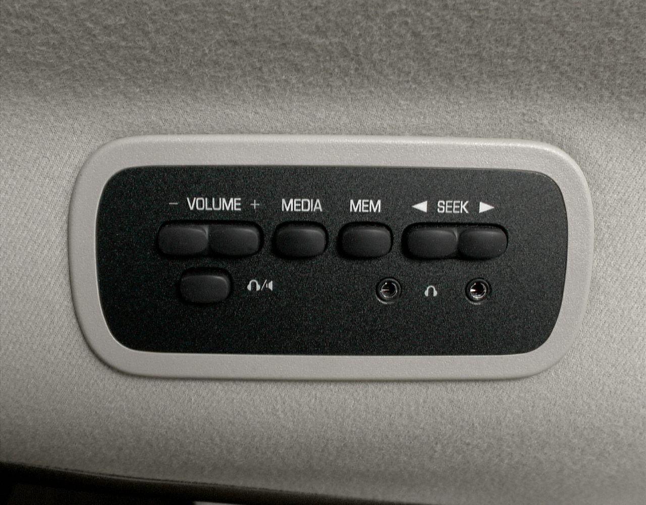 Audio control panel with buttons and headphone jacks