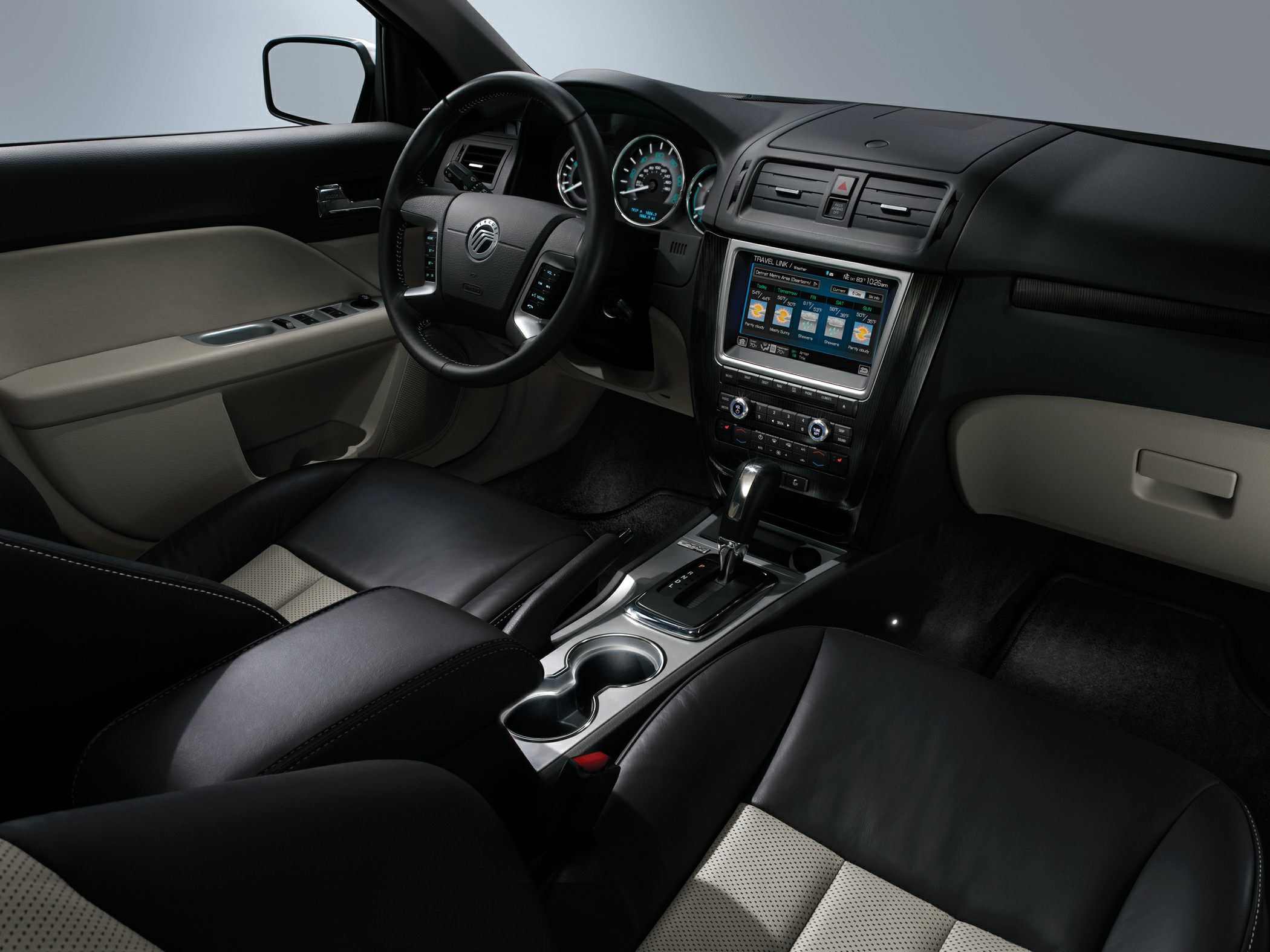 Black and beige leather seats with touchscreen infotainment in car interior