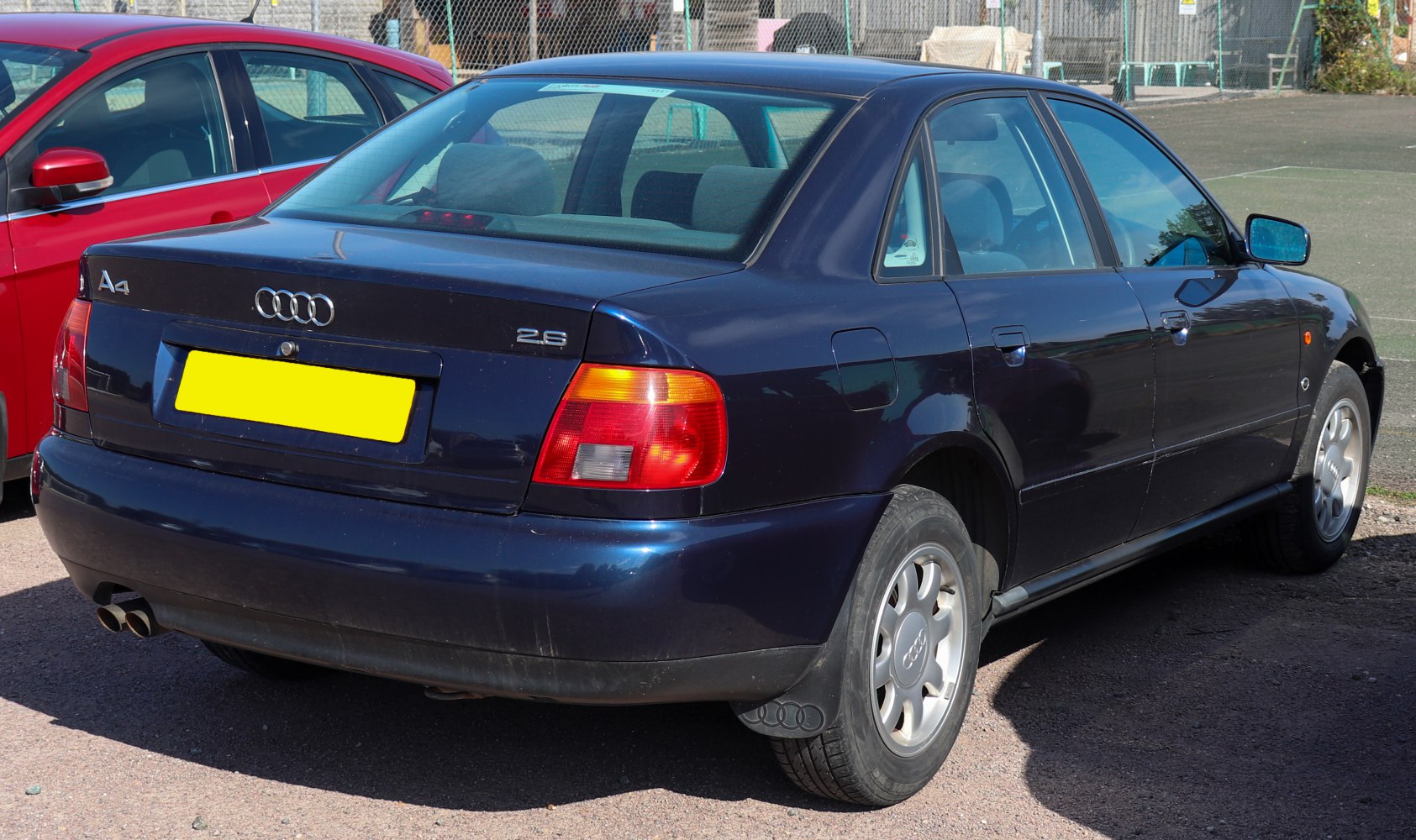 Rear view of 1995 sedan with distinctive taillights and dual exhaust