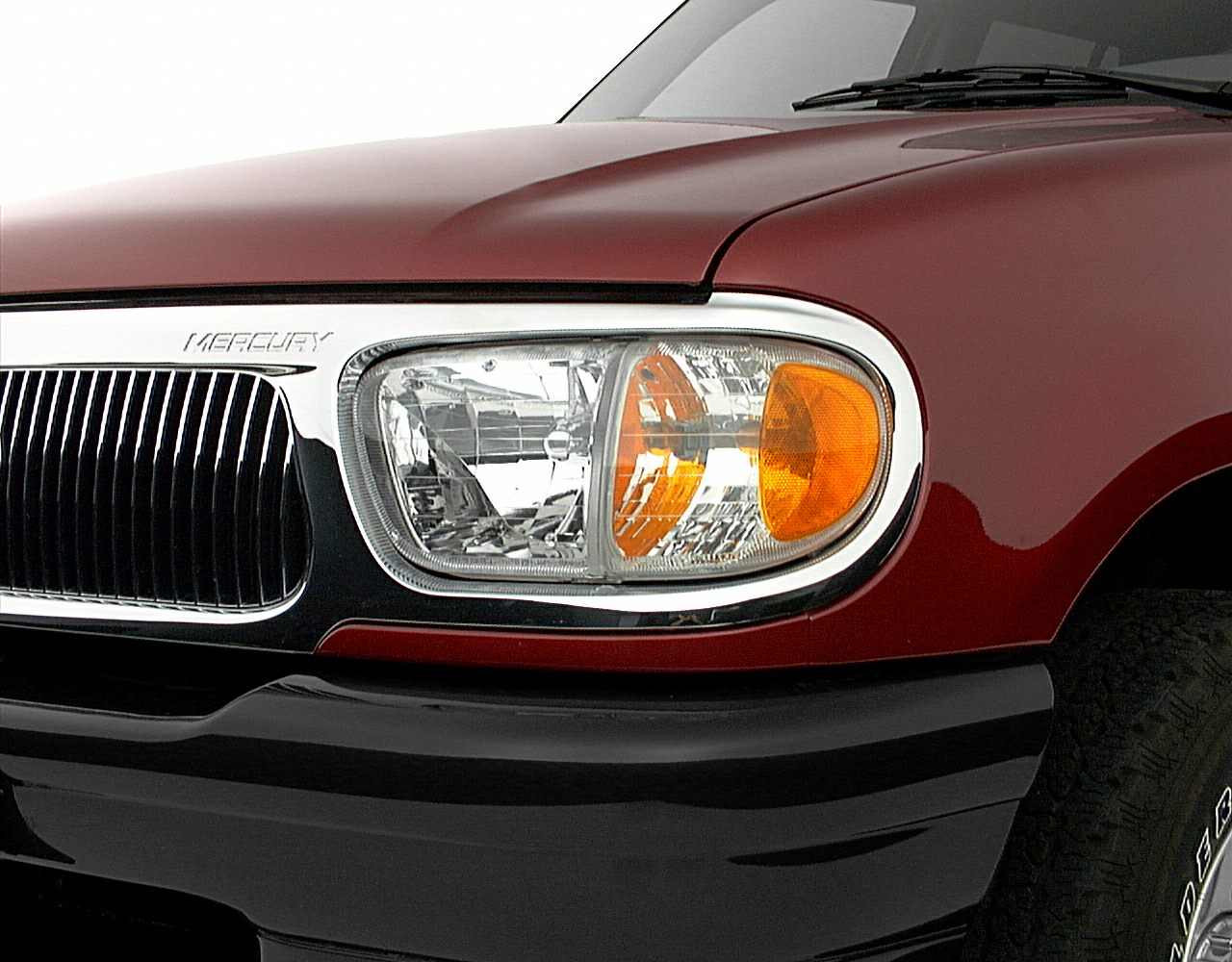 Front headlight and chrome grille with amber turn signal