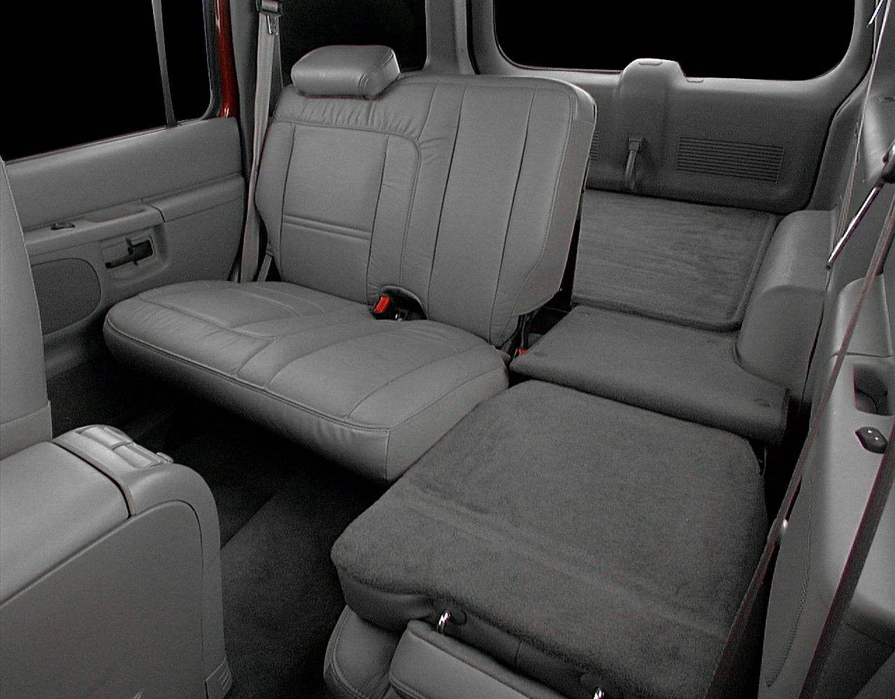 Spacious rear leather seats with fold-flat feature in SUV interior