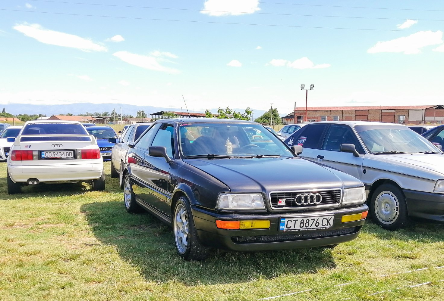 Front view of a coupe with yellow fog lights and alloy wheels