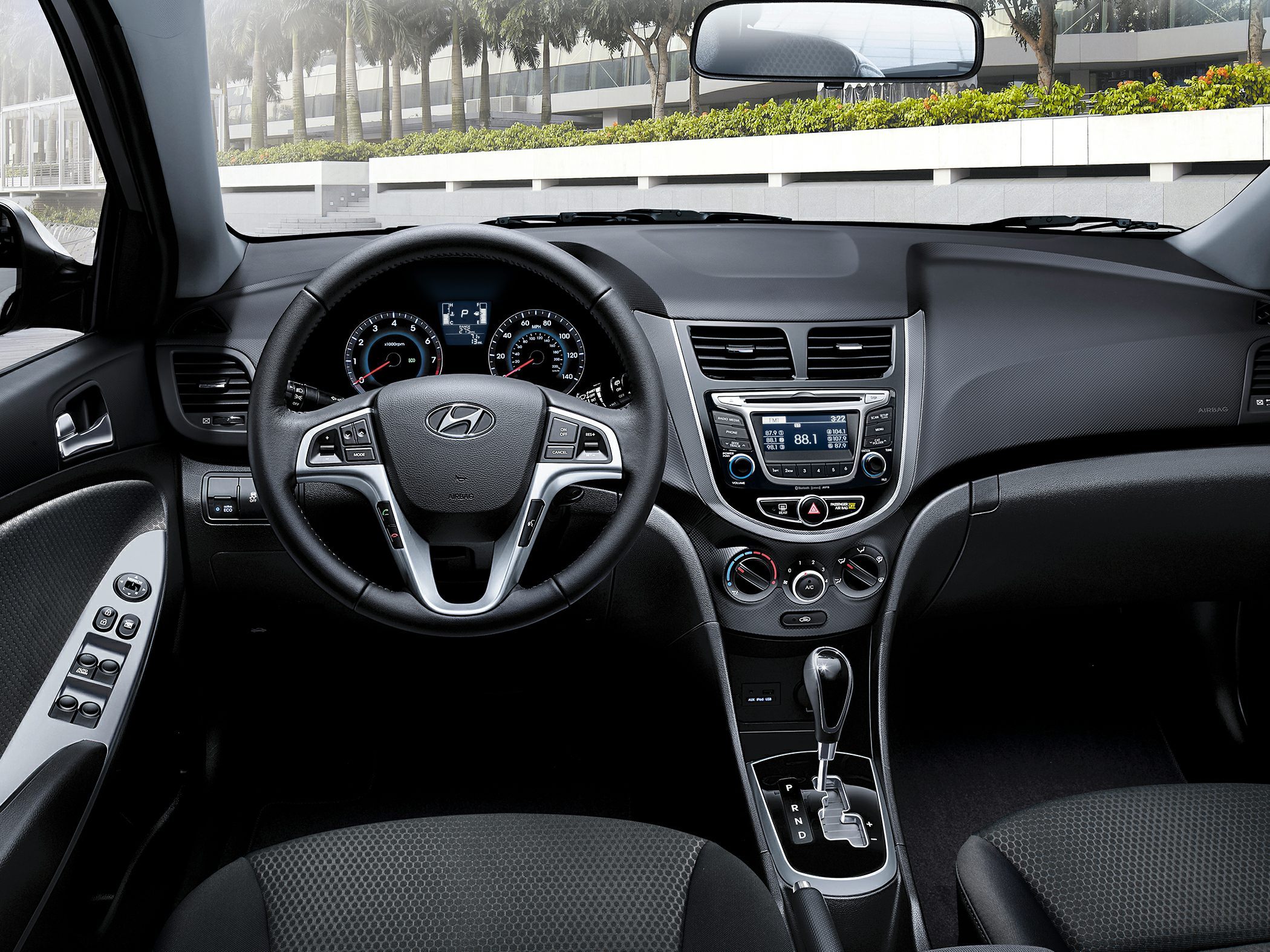 Interior dashboard with multifunction steering wheel and central console controls