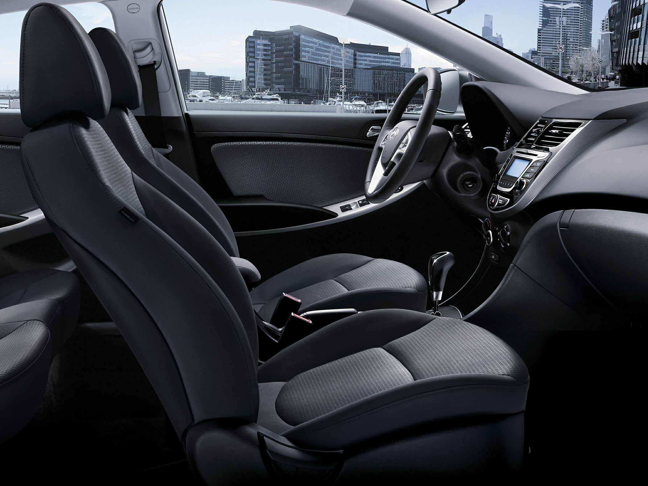 Modern car interior cabin with dashboard and front seats