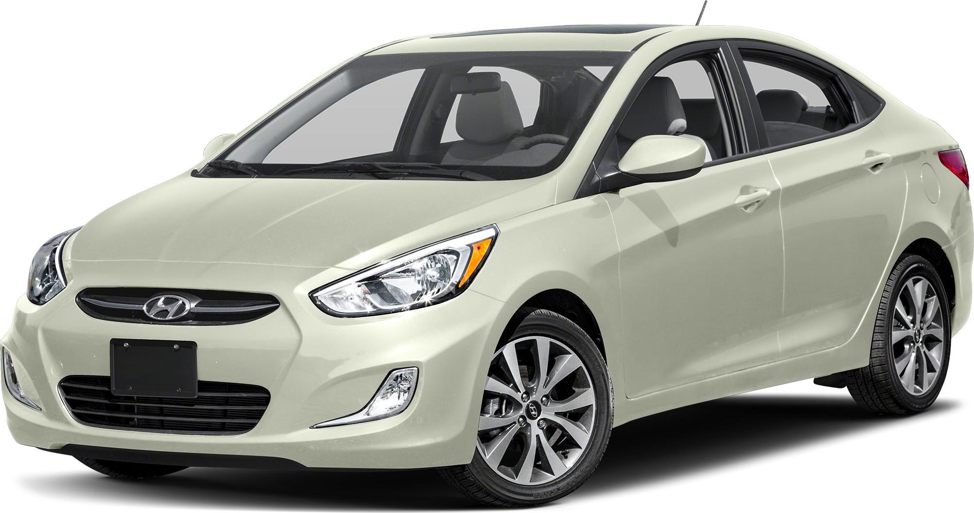 Front side view of a sedan with alloy wheels and modern headlights