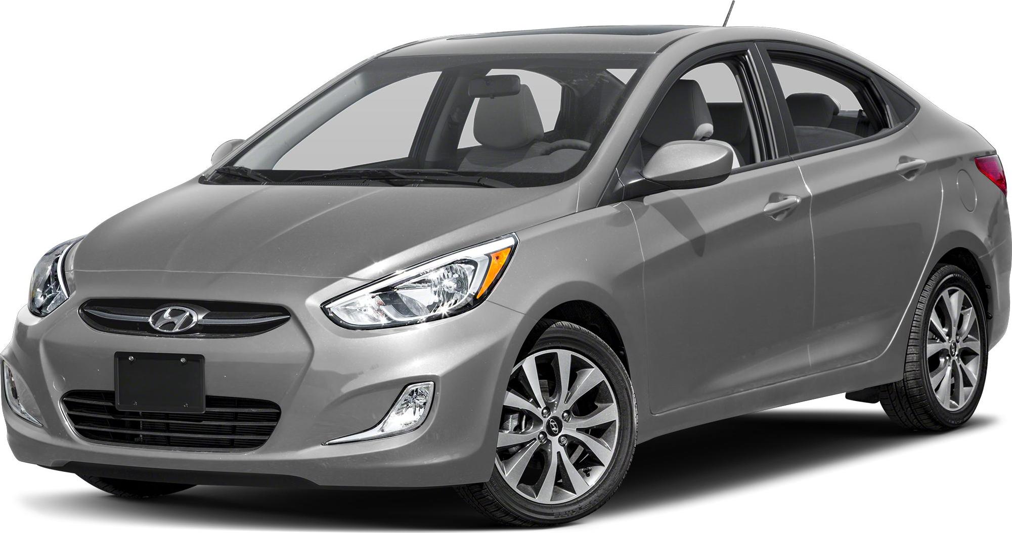 Front-side view with headlights and alloy wheels of gray sedan