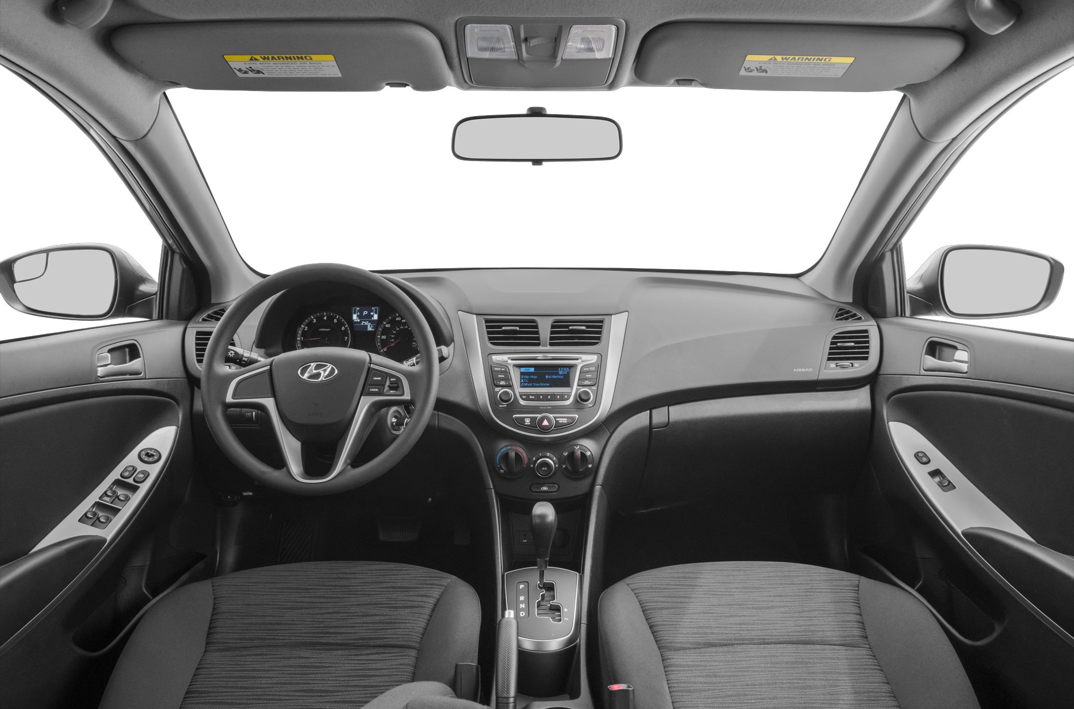 Car interior dashboard, steering wheel, center console, seats.