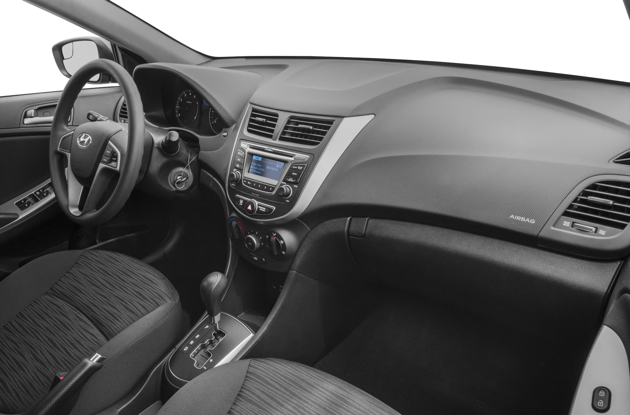 Dashboard, steering wheel, and gear shift of a car hatchback interior