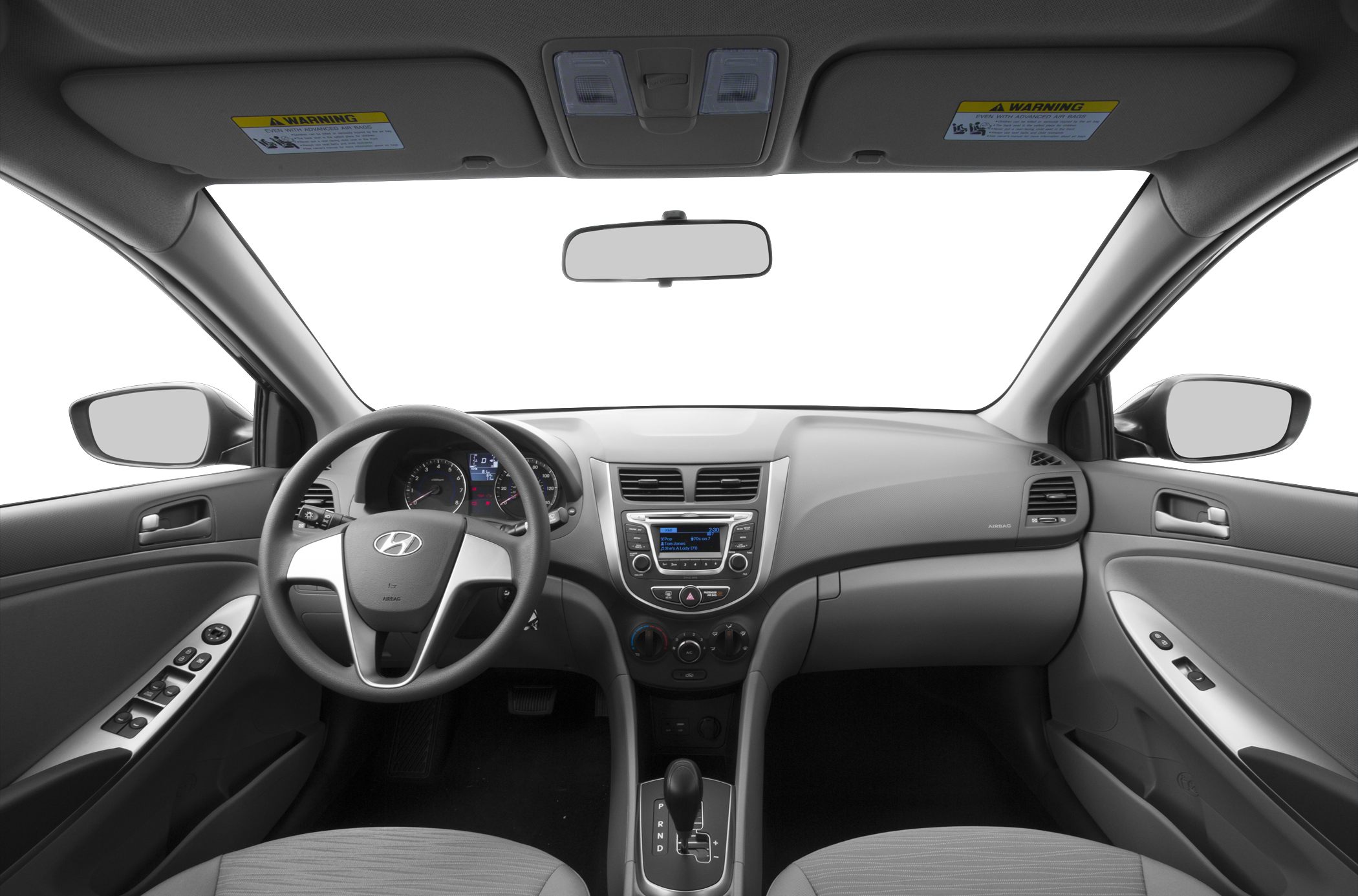 Modern dashboard and steering wheel layout with central control panel and automatic transmission shifter