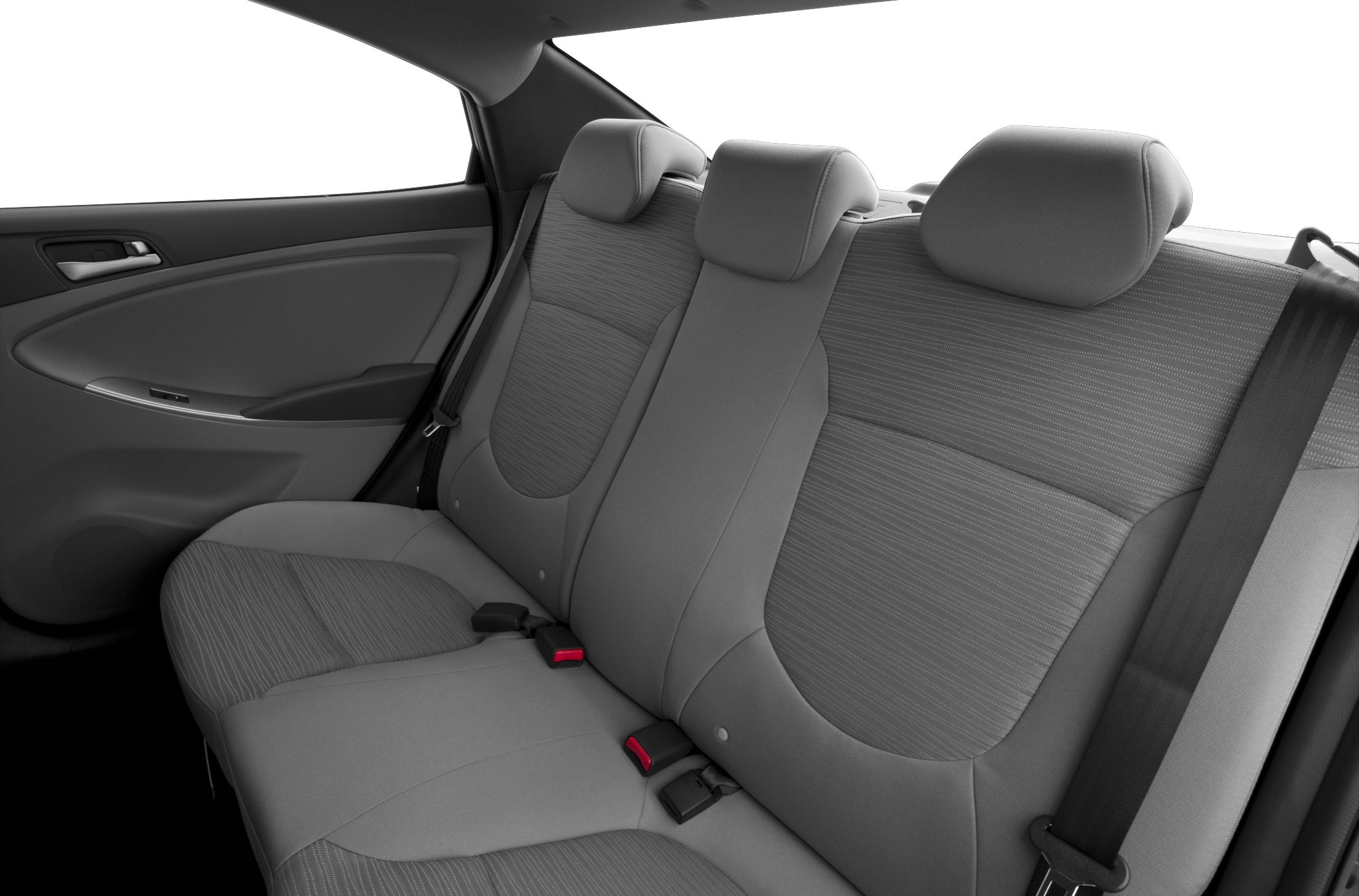 Rear seat area with fabric upholstery and seatbelt details.