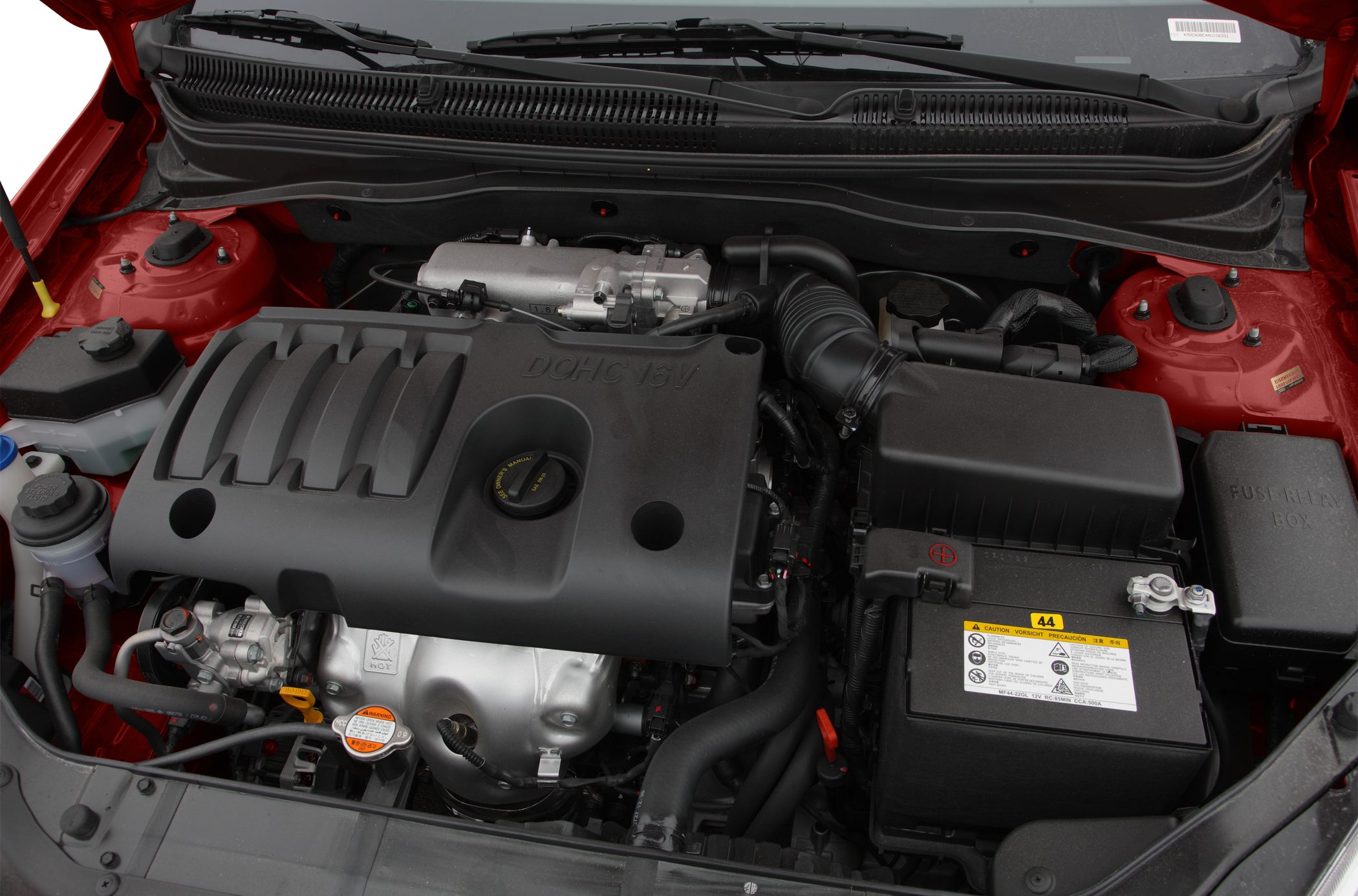 Close-up of DOHC 16V engine and battery compartment in engine bay