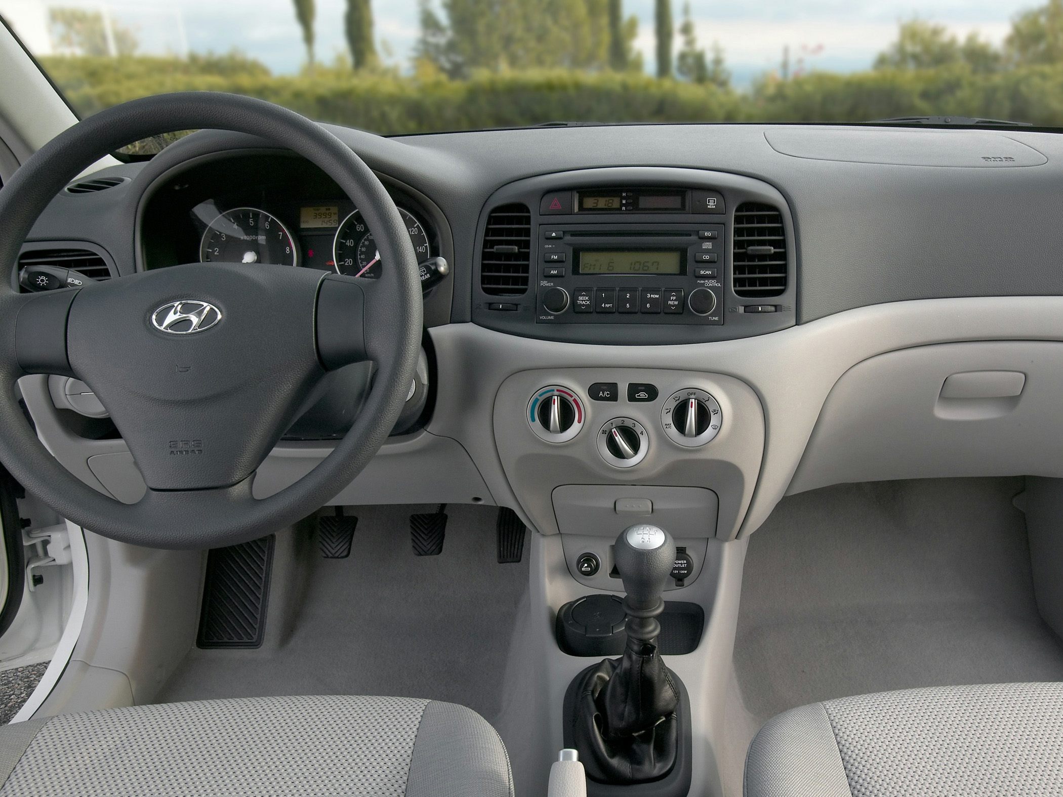 Manual transmission and classic dashboard layout in compact car interior