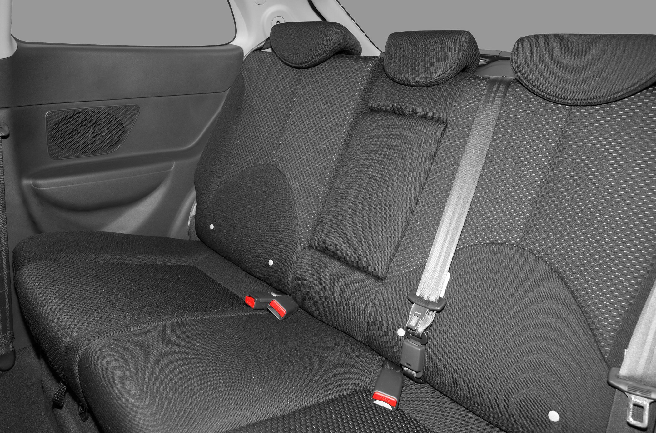 Rear seating area with fabric upholstery and seatbelts
