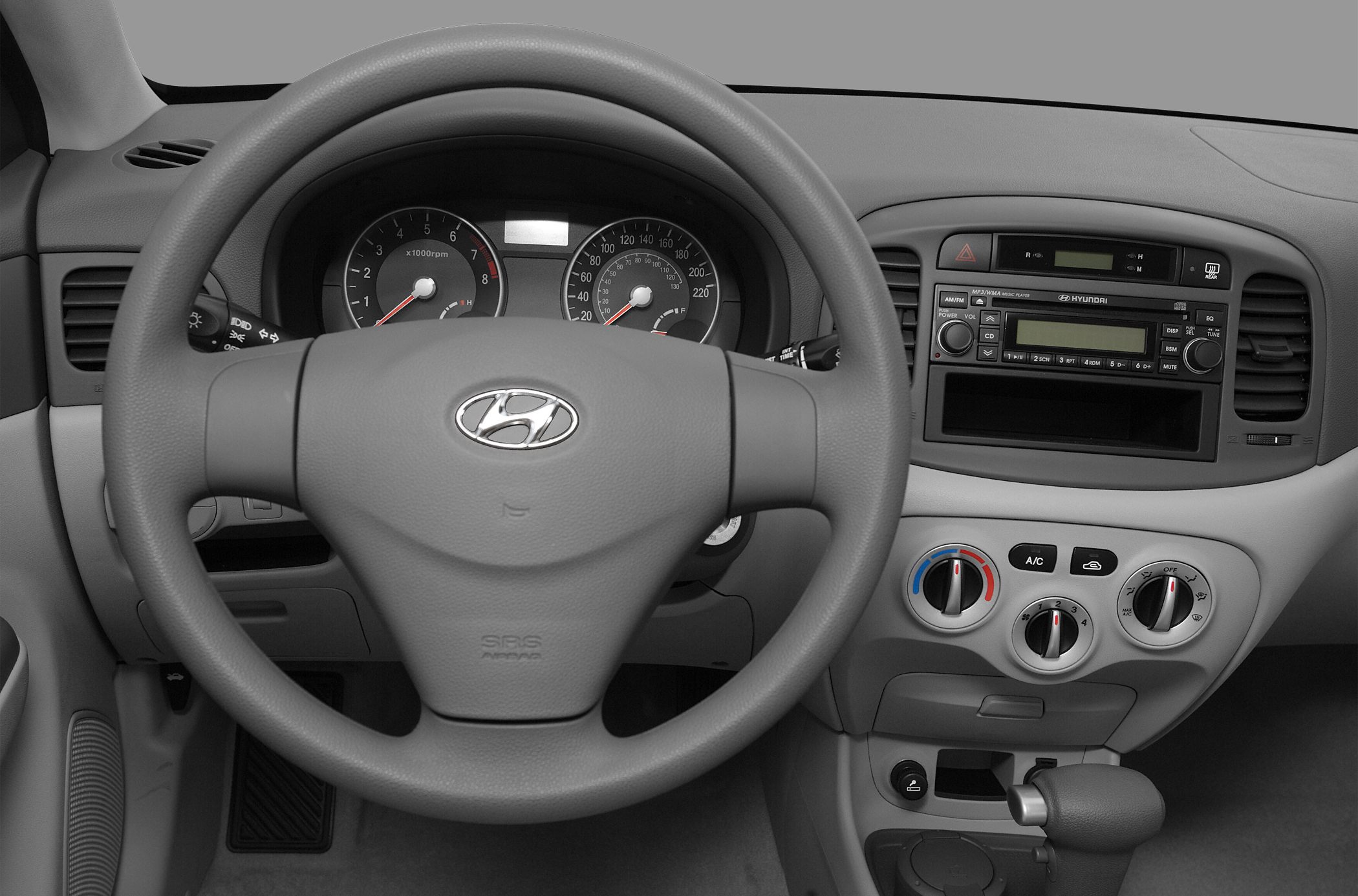 Dashboard and steering wheel with instruments and controls.