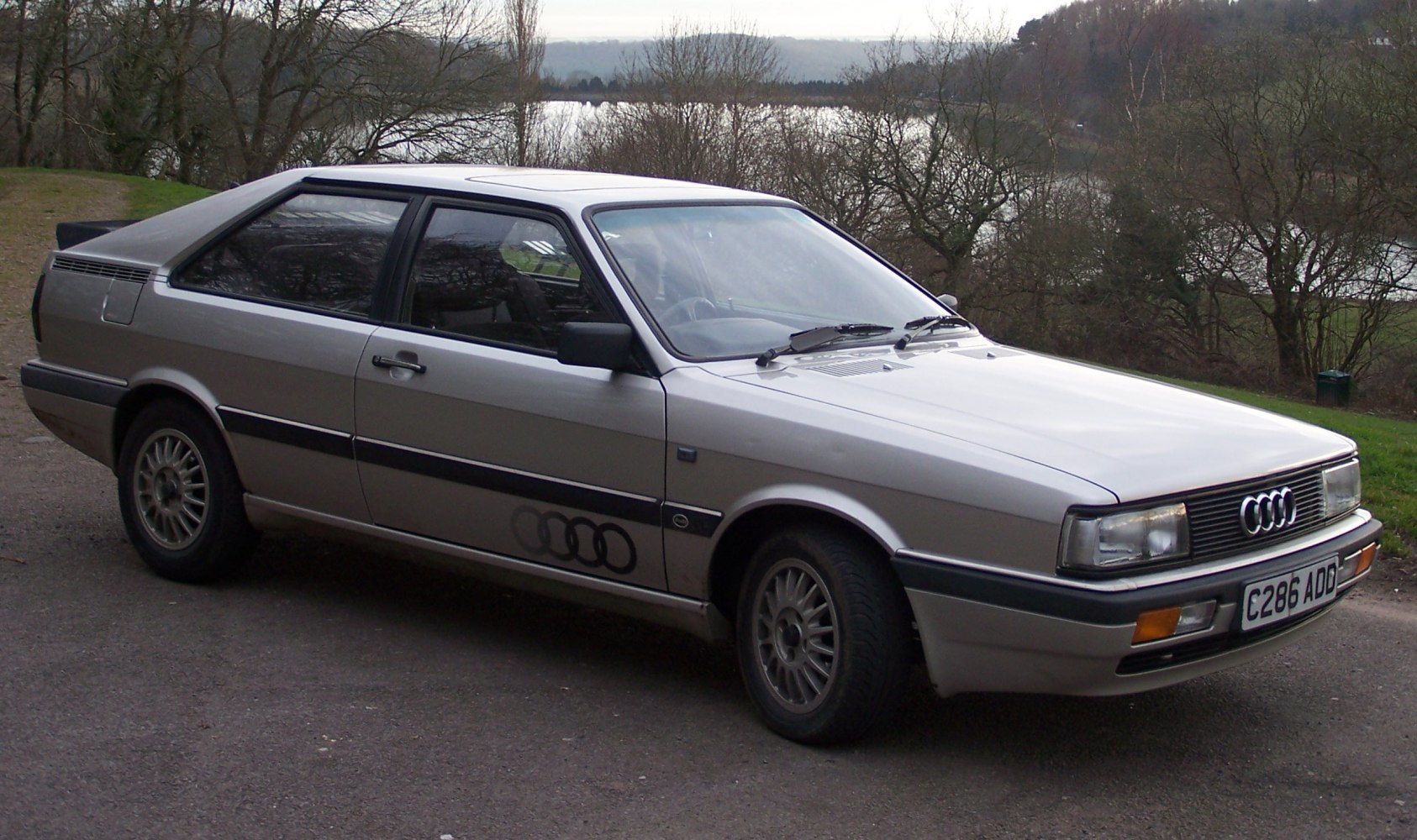 Two-door 1980s coupe with angular design and rear hatchback
