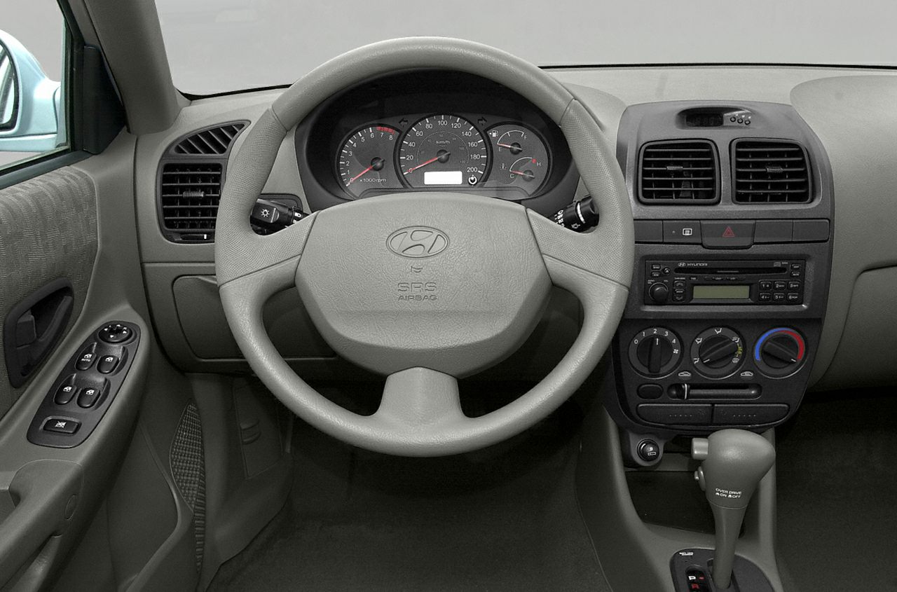 Dashboard and steering wheel with control panel and gear shift