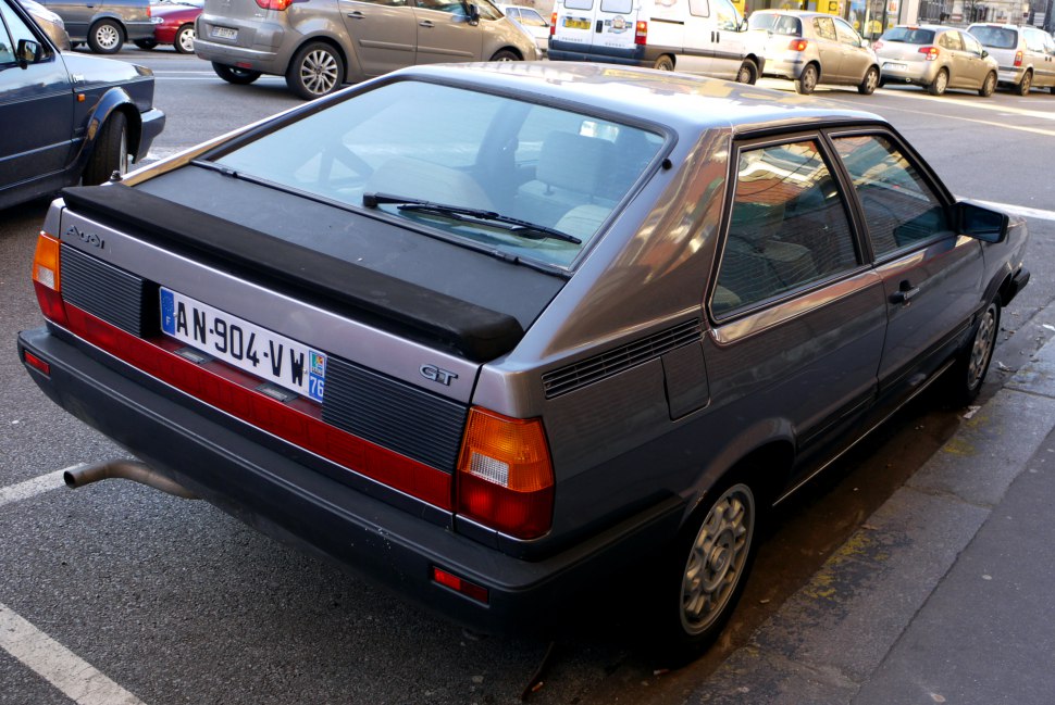 Rear hatchback view with spoiler and distinctive taillights