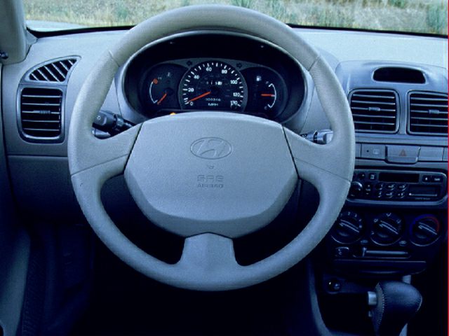 Steering wheel and dashboard with instrument cluster and air conditioning controls