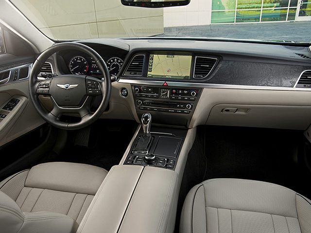 Dashboard with navigation screen and steering wheel in luxury sedan interior